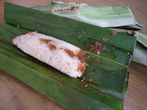 Otak-otak: sticky rice with sambal belachan wrapped in banana leaves. It's spicy!