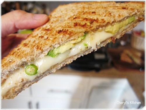 Thick layer of Swiss cheese and avocado, with a dash of green chillies (love that spicy surprise in a panini). Thick layer of Swiss cheese and avocado, with a dash of green chillies (love that spicy surprise in a panini).
