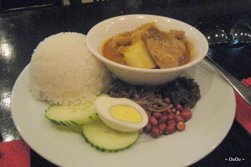 Nasi Lemak (Sambal, anchovy, cucumber, hard-boiled egg, roasted peanuts, served with coconut rice and curry chicken)